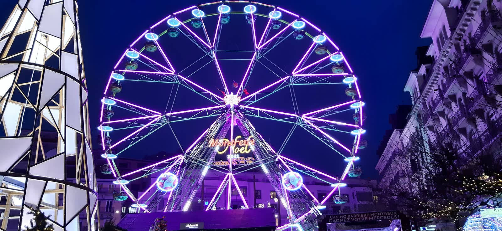 The illuminated giant wheel at the Montreux market